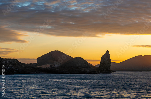 Silhouette of the Pinnacle Rock formation on Bartolome Island at sunset  Galapagos national park  Ecuador.