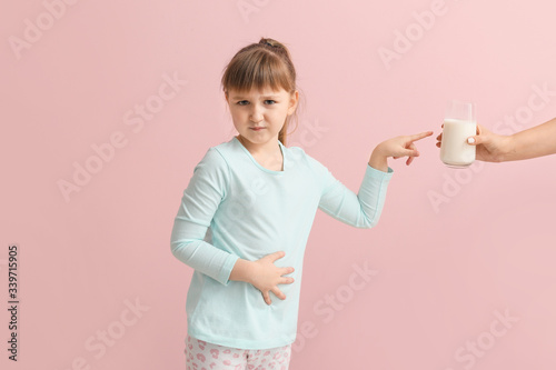 Little girl with milk aller...