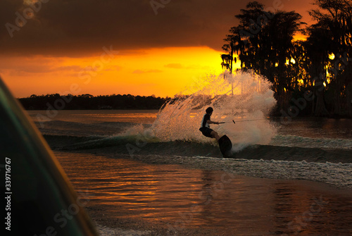 Wakeboarding on the lake at sunset in florida