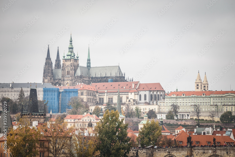 Panorama of the Old Town of Prague, Czech Republic, with a focus on Hradcany hill and the Prague Castle with the St Vitus Cathedral (Prazsky hill) seen from the Vltava river. 