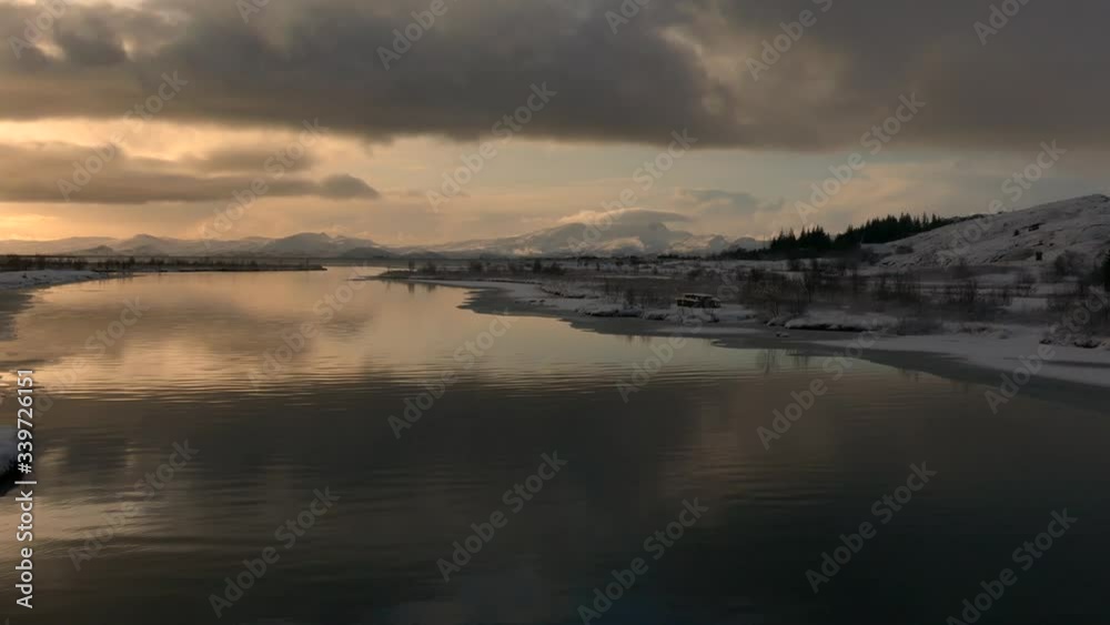 Right to left pan of beautiful Thingvallavatn lake during winter near sunset Right to left pan of beautiful Thingvallavatn lake during winter near sunset
