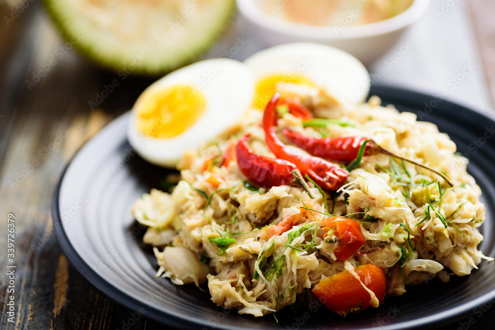 Northern Thai food (Tam Khanun), spicy pounded young jackfruit salad with boiled egg