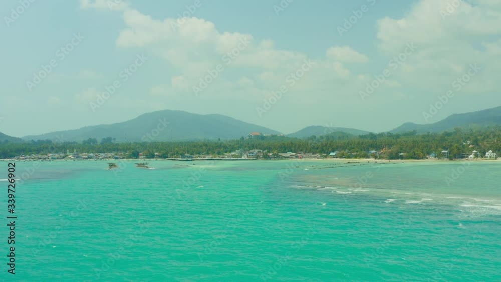 View from drone to small uninhabited island in Siam Bay which at night disappears underwater shoot from quadrocopter at altitude bird flight on Samui Island in Thailand View from drone to small uninhabited island in Siam Bay which at night disappears underwater shoot from quadrocopter at altitude bird flight on Samui Island in Thailand
