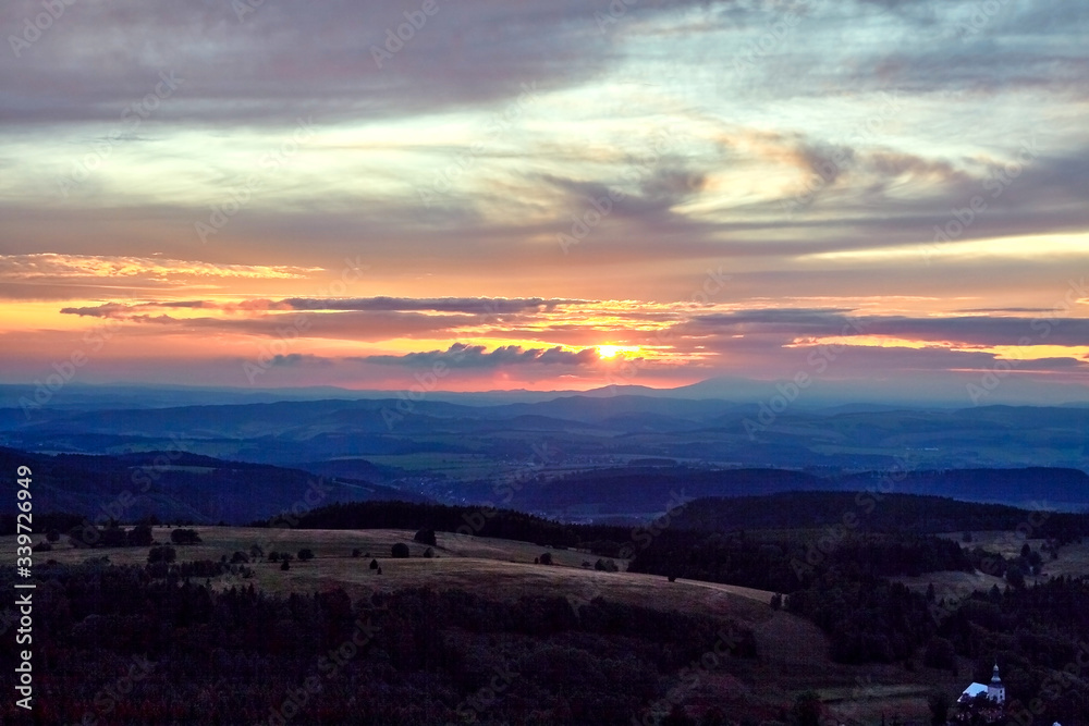 Sunset seen from Szczeliniec Wielki peak in Table Mountains, Poland