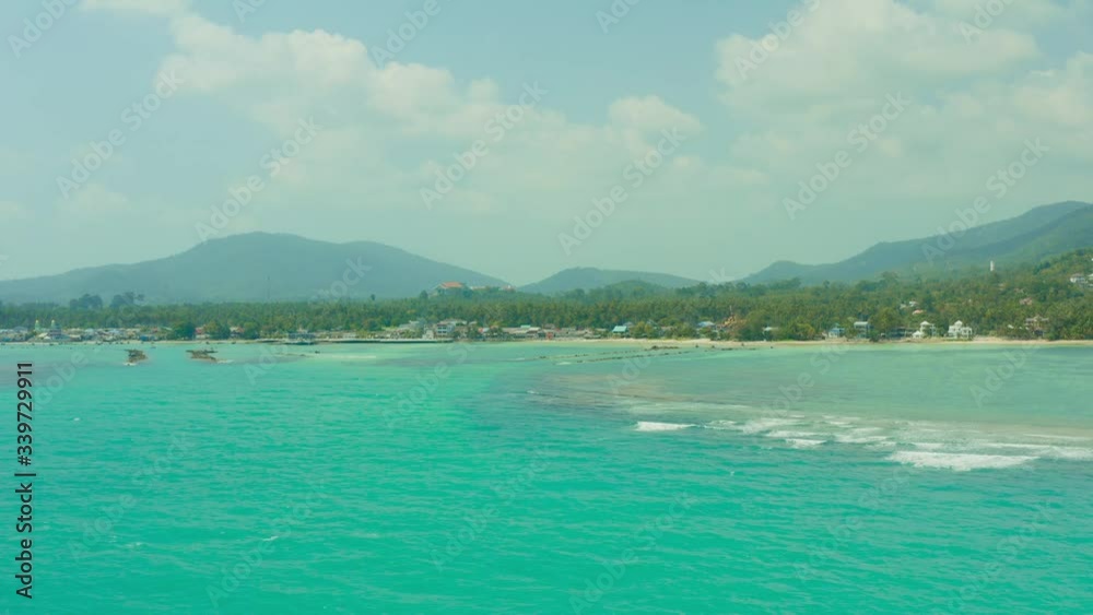 View from drone to small uninhabited island in Siam Bay which at night disappears underwater shoot from quadrocopter at altitude bird flight on Samui Island in Thailand View from drone to small uninhabited island in Siam Bay which at night disappears underwater shoot from quadrocopter at altitude bird flight on Samui Island in Thailand
