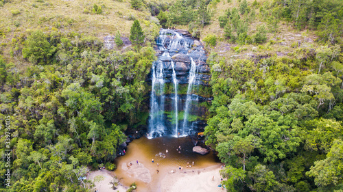 Cachoeira da Mariquinha. Aerial view of Mariquinha watherfall in Ponta Grossa - Paraná – Brazil. Beautiful waterfall between rocks and green vegetation with a river beach photo