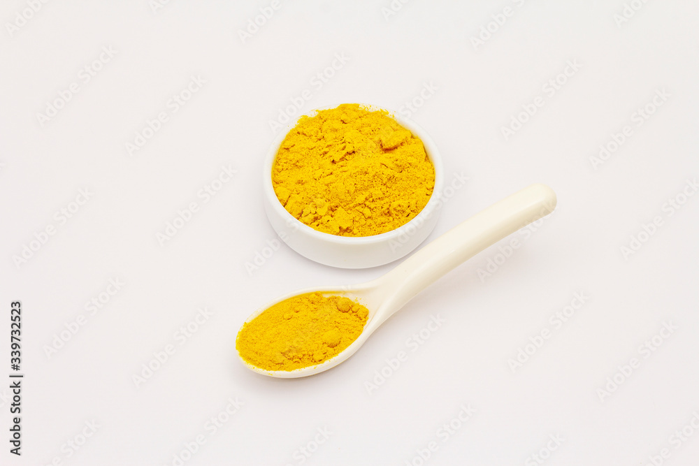 Dry turmeric powder isolated on white background Dry turmeric powder isolated on white background