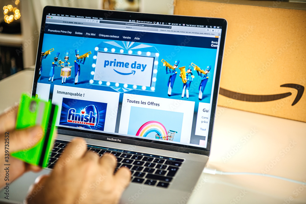 PARIS, FRANCE - JUL 16 2019: Man POV looking at Amazon France Prime Day  shopping deals on