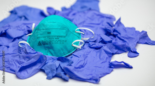 Particulate Respirator on Medical Blue Gloves photo