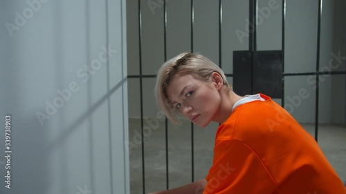 Prison for women. The criminal is sitting in his cell