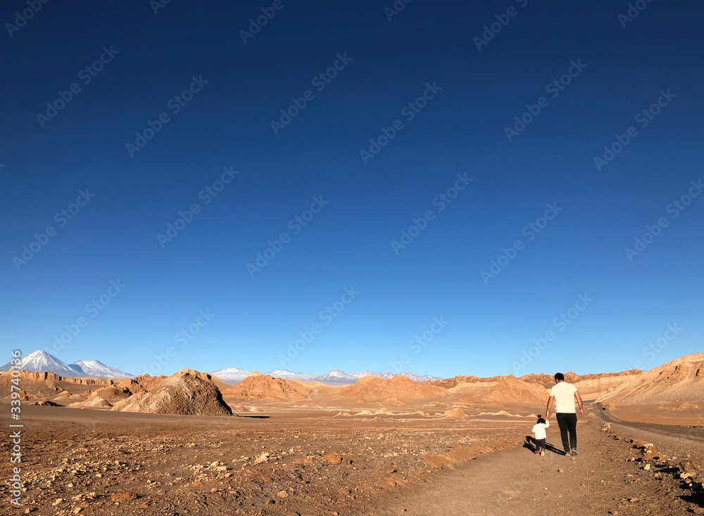 father and daughter in desert