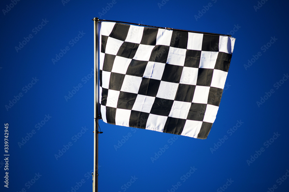checkered flag on blue sky