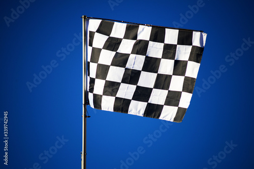 checkered flag on blue sky