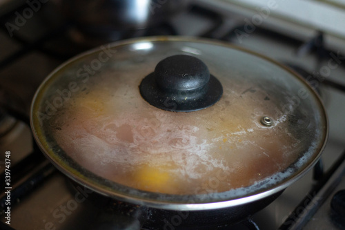 Cooking fried eggs in a pan