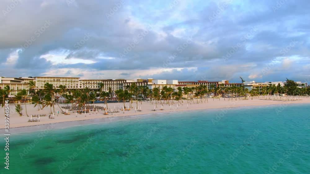 Tropical all inclusive resort and hotel with sand beach, palm trees and turquoise water, aerial view of exclusive travel destination in the Caribbean, Dominican Republic, Punta Cana