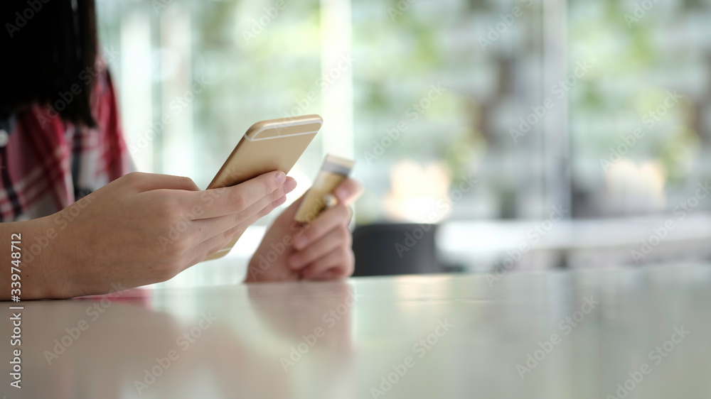 asian young business hands holding credit card and using laptop smart phone Online shopping Website,Article, Blog.Easy Ecommerce Website Shop Online by Smartphone.Online shopping concept asian young business hands holding credit card and using laptop smart phone Online shopping Website,Article, Blog.Easy Ecommerce Website Shop Online by Smartphone.Online shopping concept