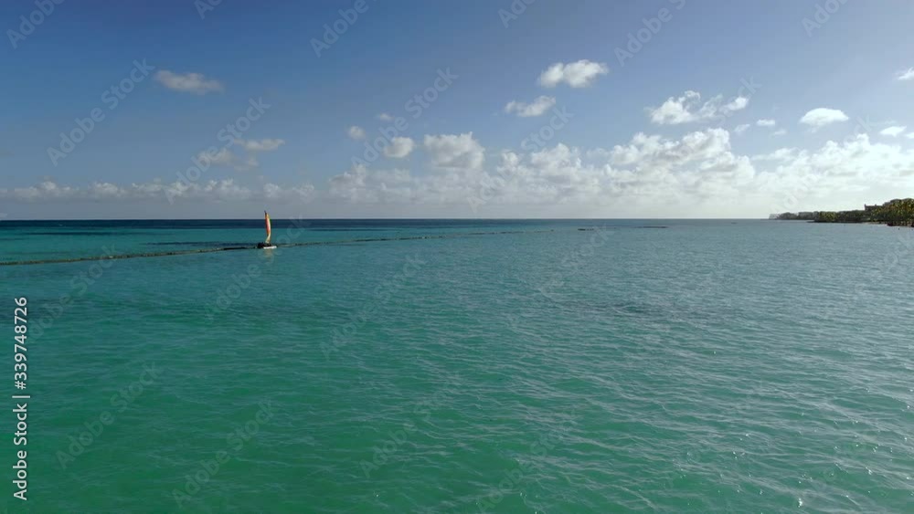 Recreational sailing on small catamaran in turquoise Caribbean sea in Dominican Republic, beach fun and watersports, active vacation lifestyle Recreational sailing on small catamaran in turquoise Caribbean sea in Dominican Republic, beach fun and watersports, active vacation lifestyle