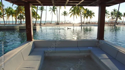 Paradise dream in tropical resort, infinity pool and luxury beach resort in Caribbean sea, exotic tourist resort with deckchairs and lounge are, idillyc hotel in Dominican Republic photo