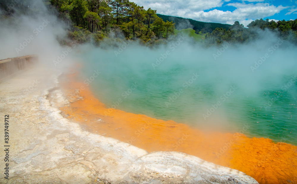 Beautiful view of Champagne pool an iconic tourist attraction of Wai-O-Tapu the geothermal wonderland in Rotorua, New Zealand. New Zealand's most colourful geothermal attraction. Beautiful view of Champagne pool an iconic tourist attraction of Wai-O-Tapu the geothermal wonderland in Rotorua, New Zealand. New Zealand's most colourful geothermal attraction.