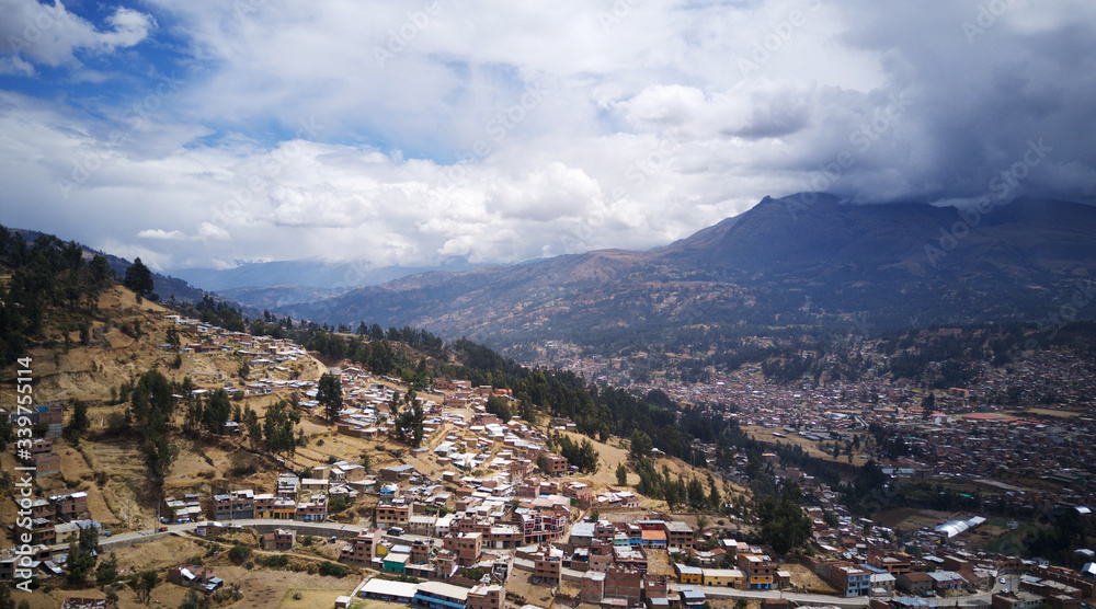 Aerial view on mountanious city of Huaraz close to Huarascan National Park in Peru. Houses on slopes of mountains.