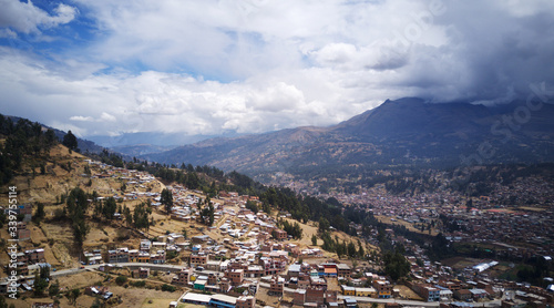 Aerial view on mountanious city of Huaraz close to Huarascan National Park in Peru. Houses on slopes of mountains. photo