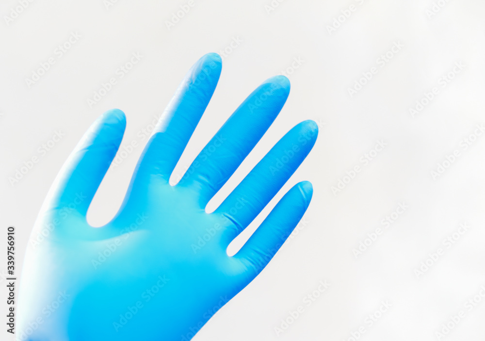 Close u p blue glove on white background. Close u p blue glove on white background.