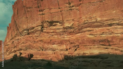 Sunrise glowing on massive red rock geologic layers of horizontal rock, Colorado photo