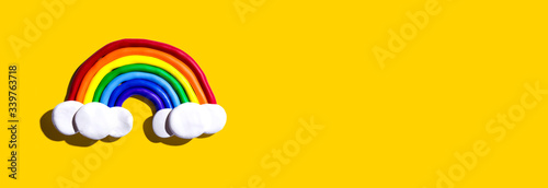 Εκτύπωση καμβά Rainbow and white clouds made with clay - overhead view