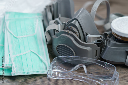 Schilderij op canvas Respirator mask and surgical masks, corona virus or Covid-19 protection