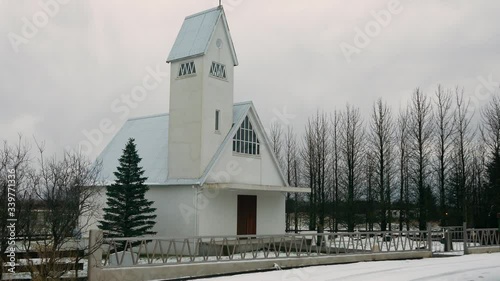 SELFOSS, ICELAND: Exterior of Laugardalur church Tomb grave of the former American world chess champion Bobby Fischer photo