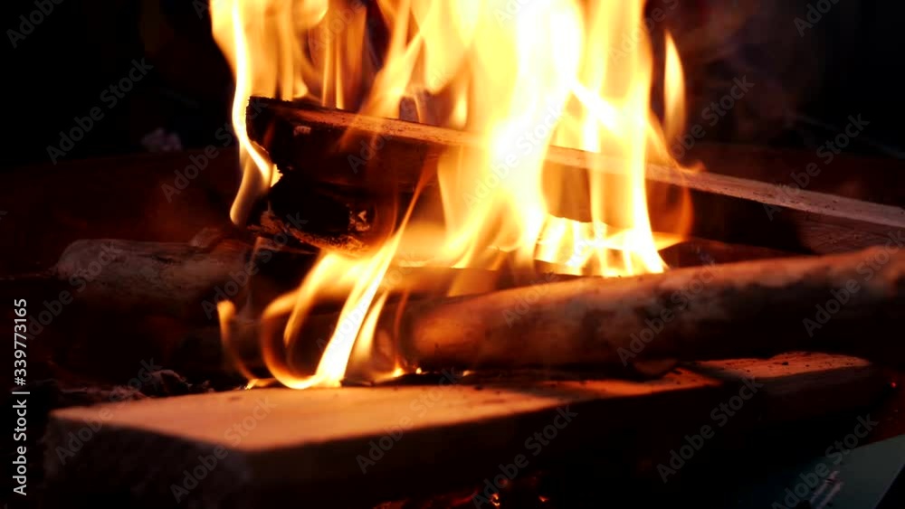 Macro close up shot of red burning campfire flames,outdoor during holiday Macro close up shot of red burning campfire flames,outdoor during holiday