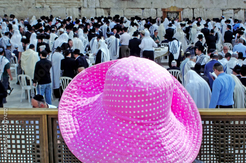 Jewish people pray at the Kotel  Wailng Western wall during the Passover Holiday photo