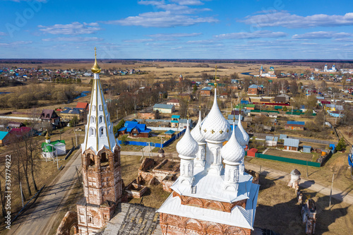 Snow-white domes of the Church of the Intercession of the Holy Virgin in the village of Dunilovo, Ivanovo Region, Russia. photo