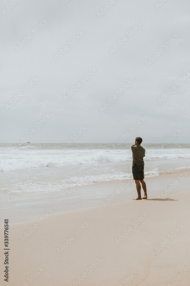 Playful man on the beach