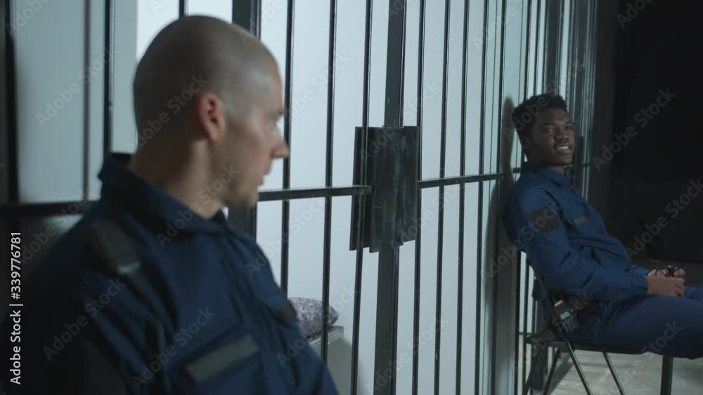 Overseers talk among themselves and look after criminals Overseers talk among themselves and look after criminals