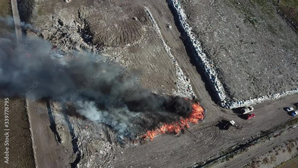 Birdseye Aerial View of Smoke From Burning Garbage in Landfill Junkyard ...