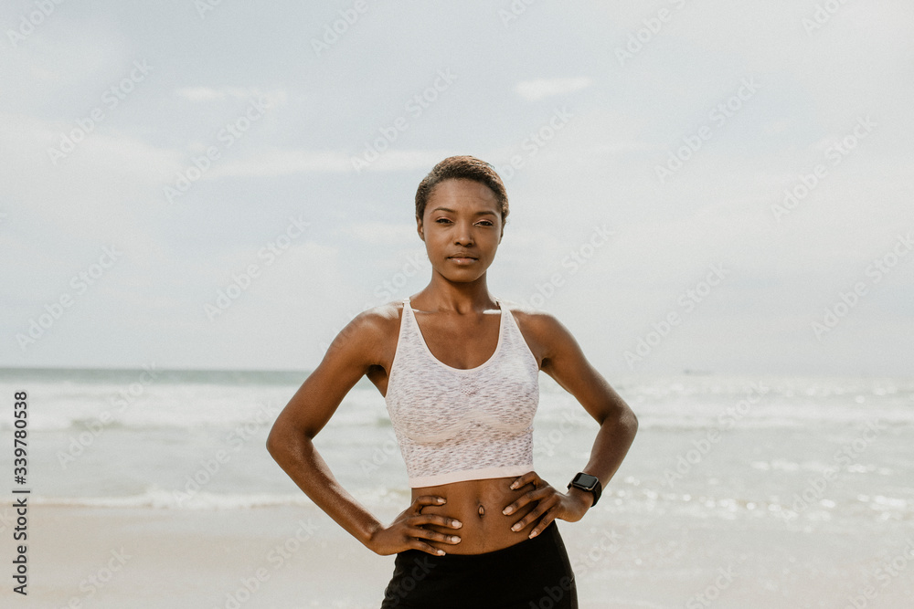 Fototapeta premium Active woman posing on the beach