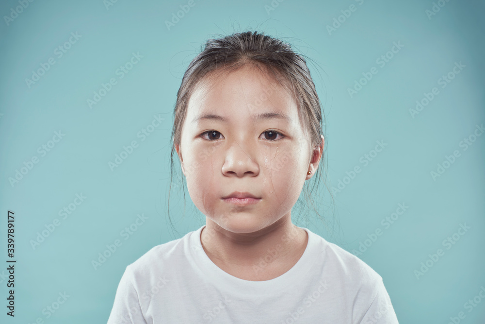 Portrait of melancholy sad crying little asian girl. - obrazy, fototapety, plakaty 