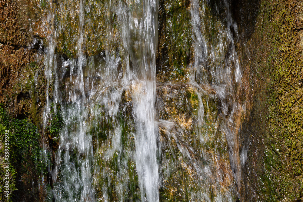 View to mini waterfall in park View to mini waterfall in park