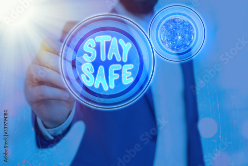 Conceptual hand writing showing Stay Safe. Concept meaning secure from threat of danger, harm or place to keep articles Elements of this image furnished by NASA photo