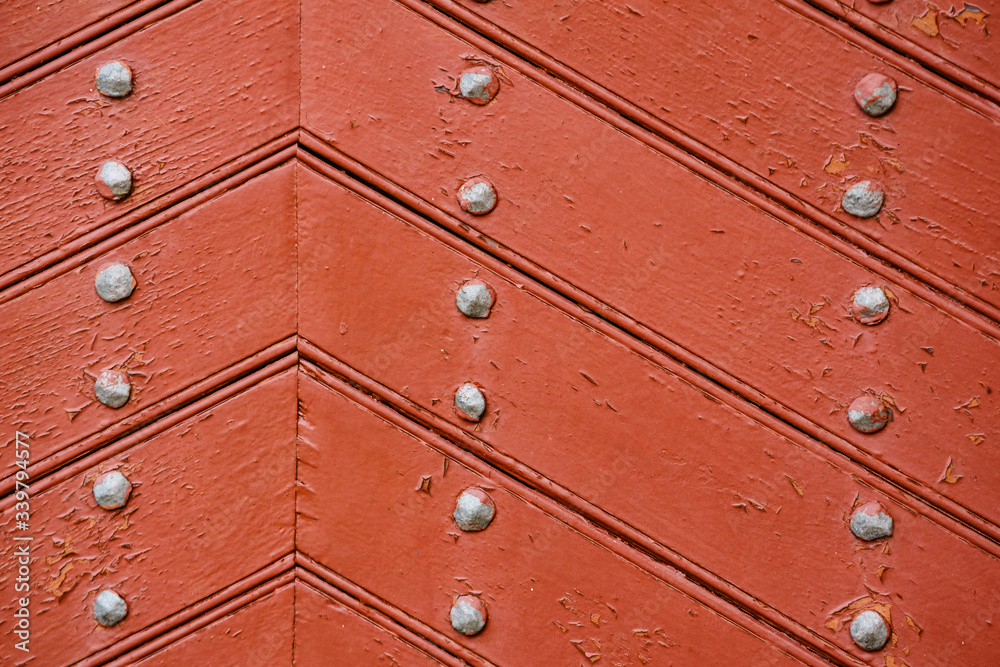 Old wooden background with metal rivets
