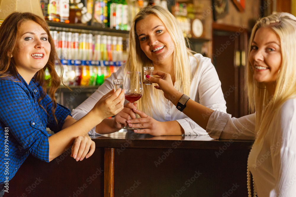Girls in pub club gossiping and talking Girls in pub club gossiping and talking