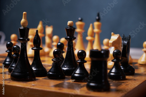 Businessman hand moving of playing chess strategyconcept: symbol confident new strategy plan for win and success, sports game thinking battle planning object achievement queen for successful photo