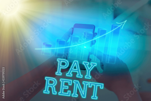 Handwriting text writing Pay Rent. Conceptual photo To pay money in exchange for the use of someone else s is property photo