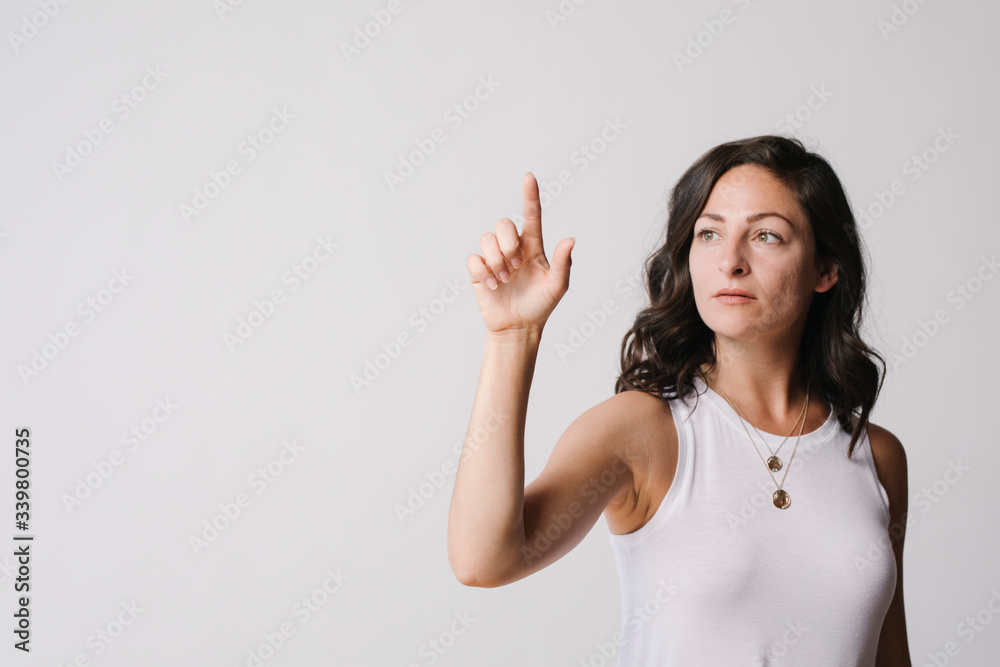 Woman using a transparent screen Woman using a transparent screen