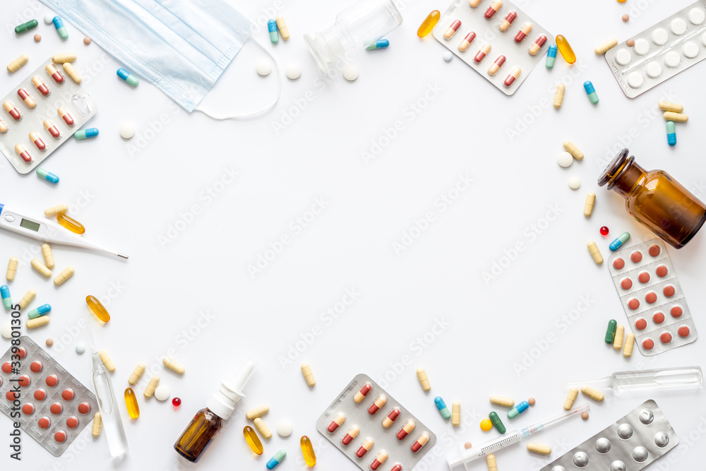 Pharmacy - pills, tablets - flu, cold health care. on white table top view space for text Pharmacy - pills, tablets - flu, cold health care. on white table top view space for text