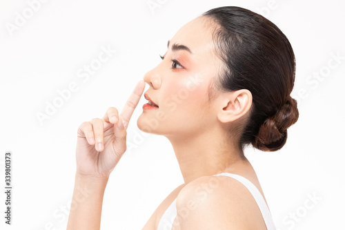 Beauty asian women touching nose portrait face with natural skin and skin care healthy hair and skin close up face beauty portrait.Beauty Concept on white background.