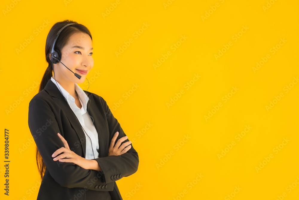 Portrait beautiful young business asian woman with headphone or headset Portrait beautiful young business asian woman with headphone or headset