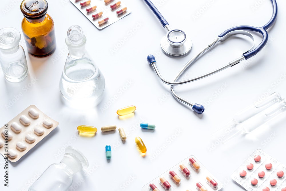 Fototapeta premium Treatment of influenza or cold. Medicine, stethoscope on white table