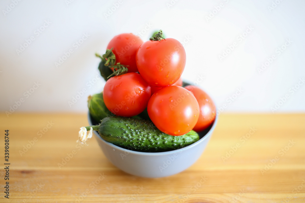 cucumbers and tomatoes on plate cucumbers and tomatoes on plate